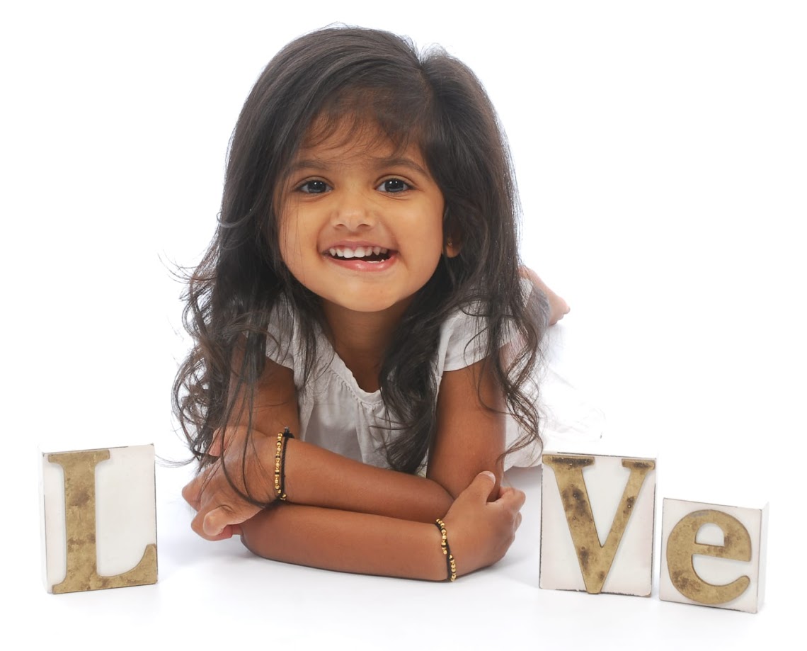 Riya with letter blocks spelling the word 'Love'